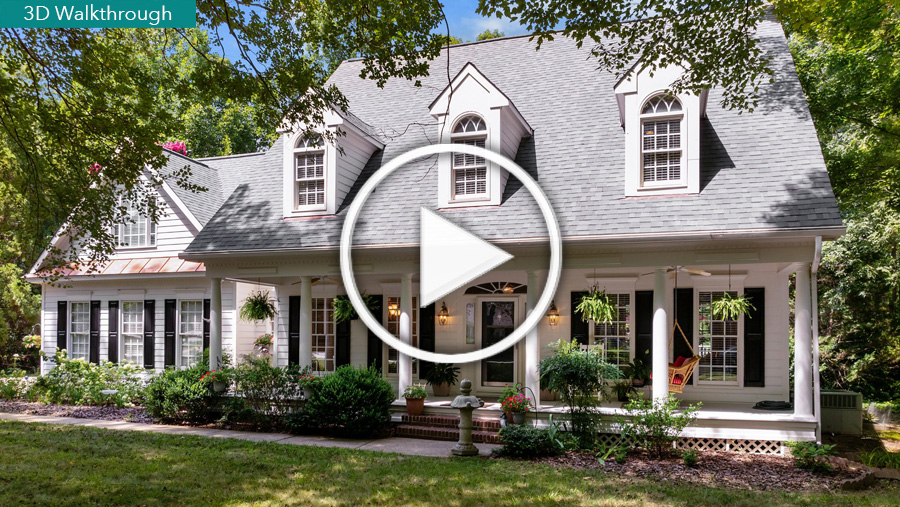 Exterior image of front of house with Play button to open the virtual tour